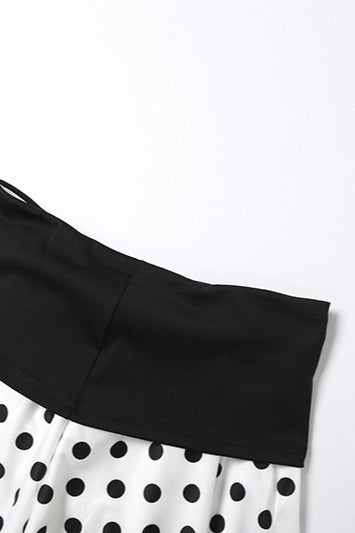 Completo due pezzi con gonna corta a pois e top a fascia con laccetti al collo