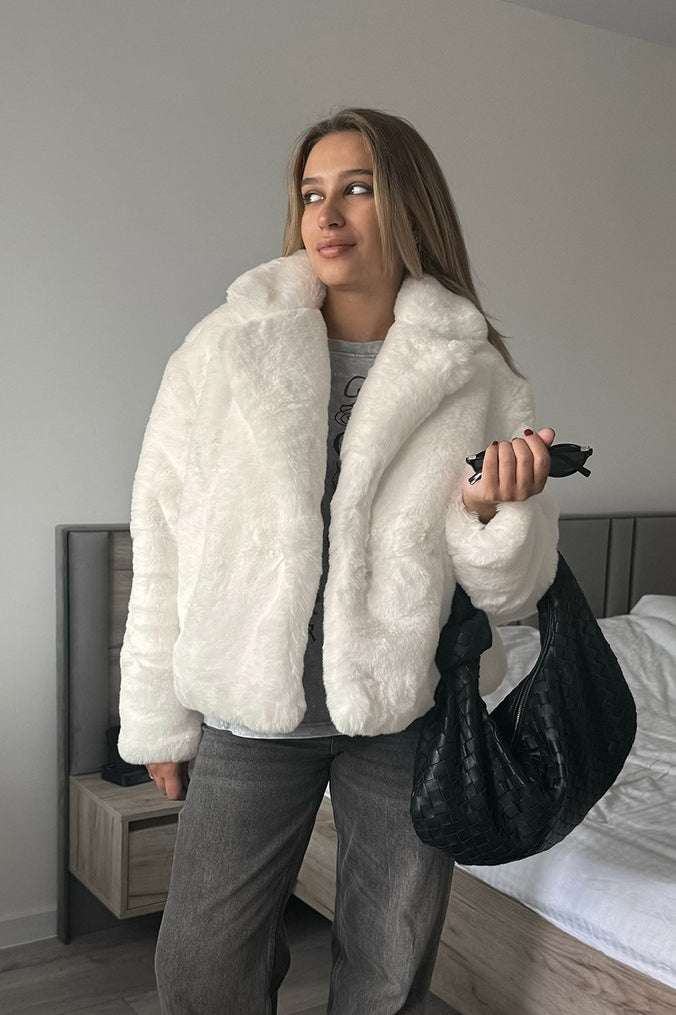 Abrigo suelto minimalista de forro polar de color sólido