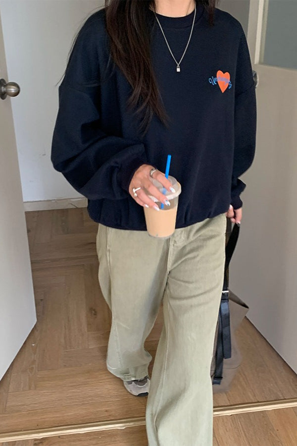 Jeans a vita alta con tasche laterali, gamba larga e sagomata