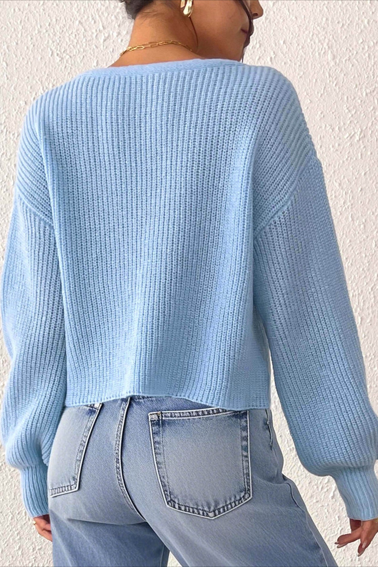 Suéter corto de punto de ganchillo con botones al frente