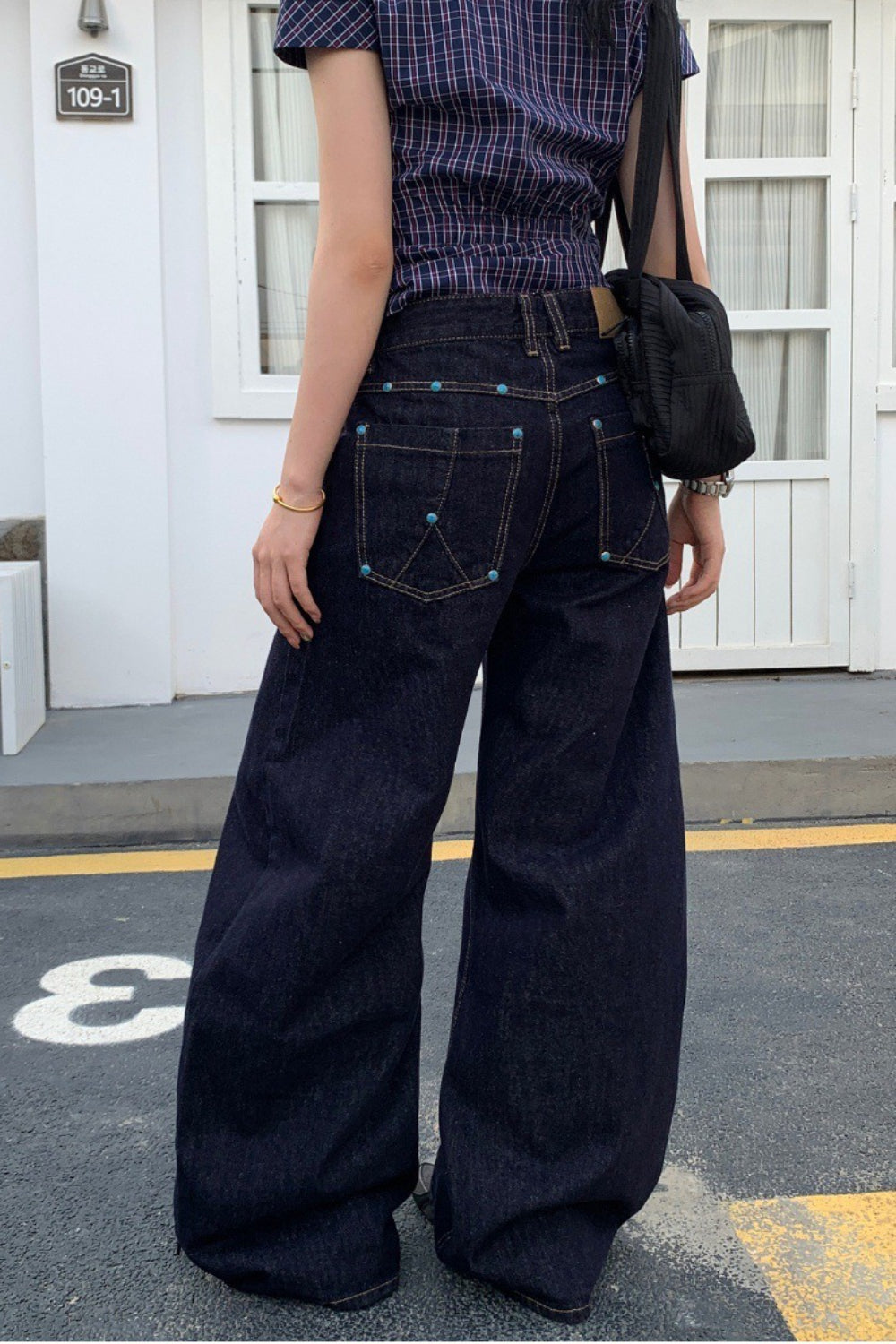 Jean à jambe large rétro avec accent en diamant massif