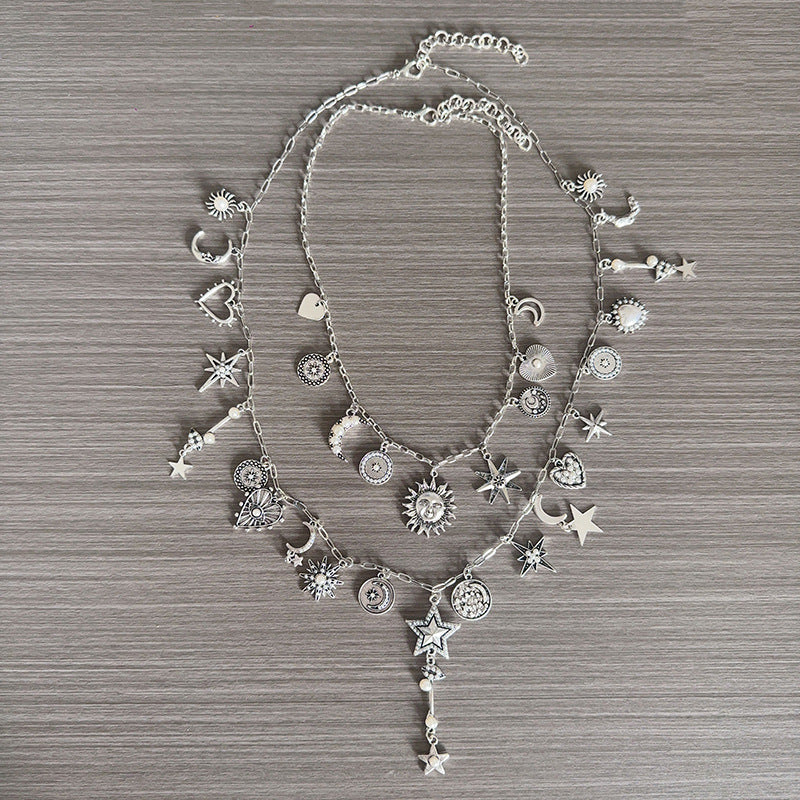 Collana con pendente a cuore, sole e luna in stile antico con nappina