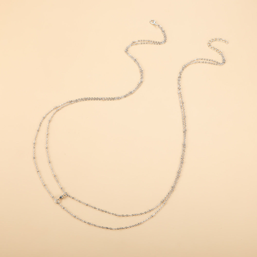 Catena sottile in metallo con strass per vita e corpo