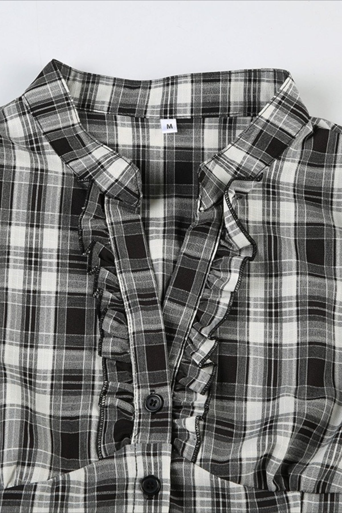 Camicia scozzese a quadri con scollo a V e maniche a sbuffo arricciate