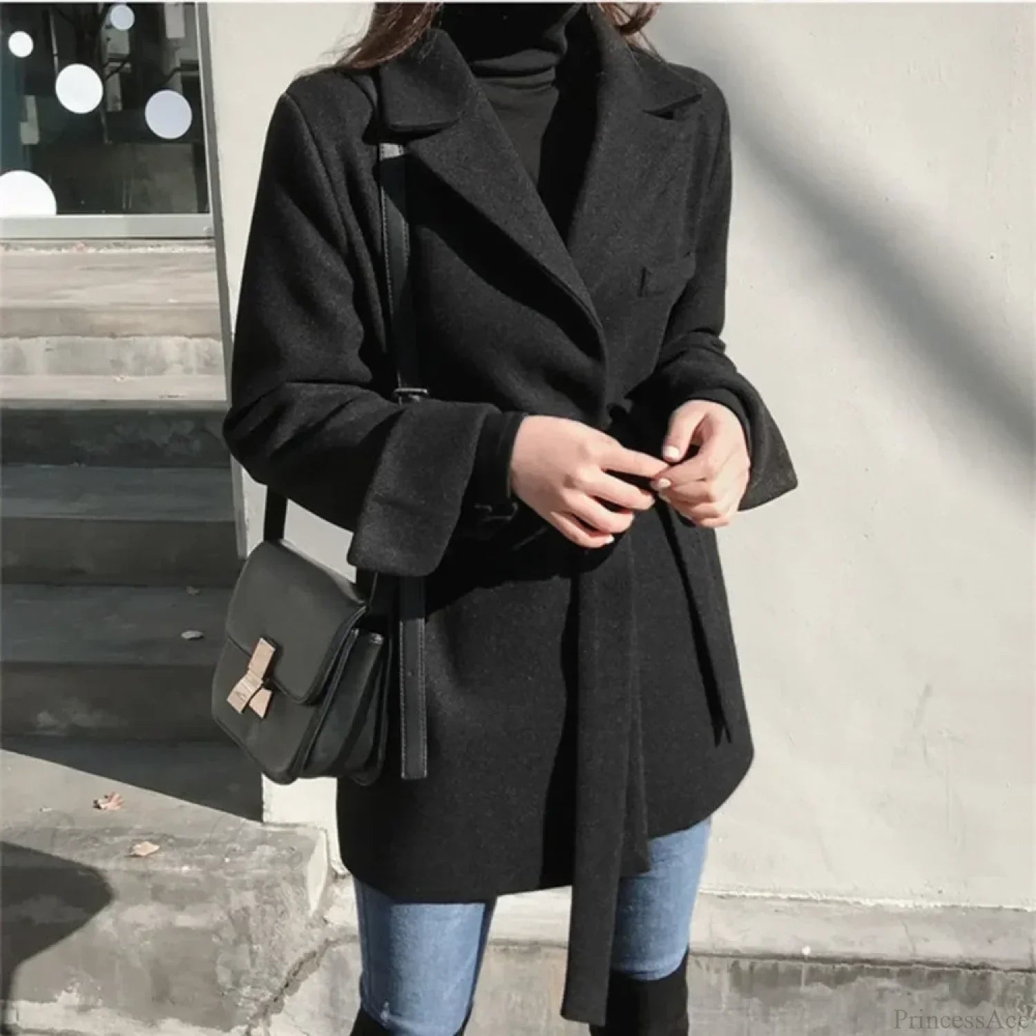 Manteau long noir en laine mélangée à lacets
