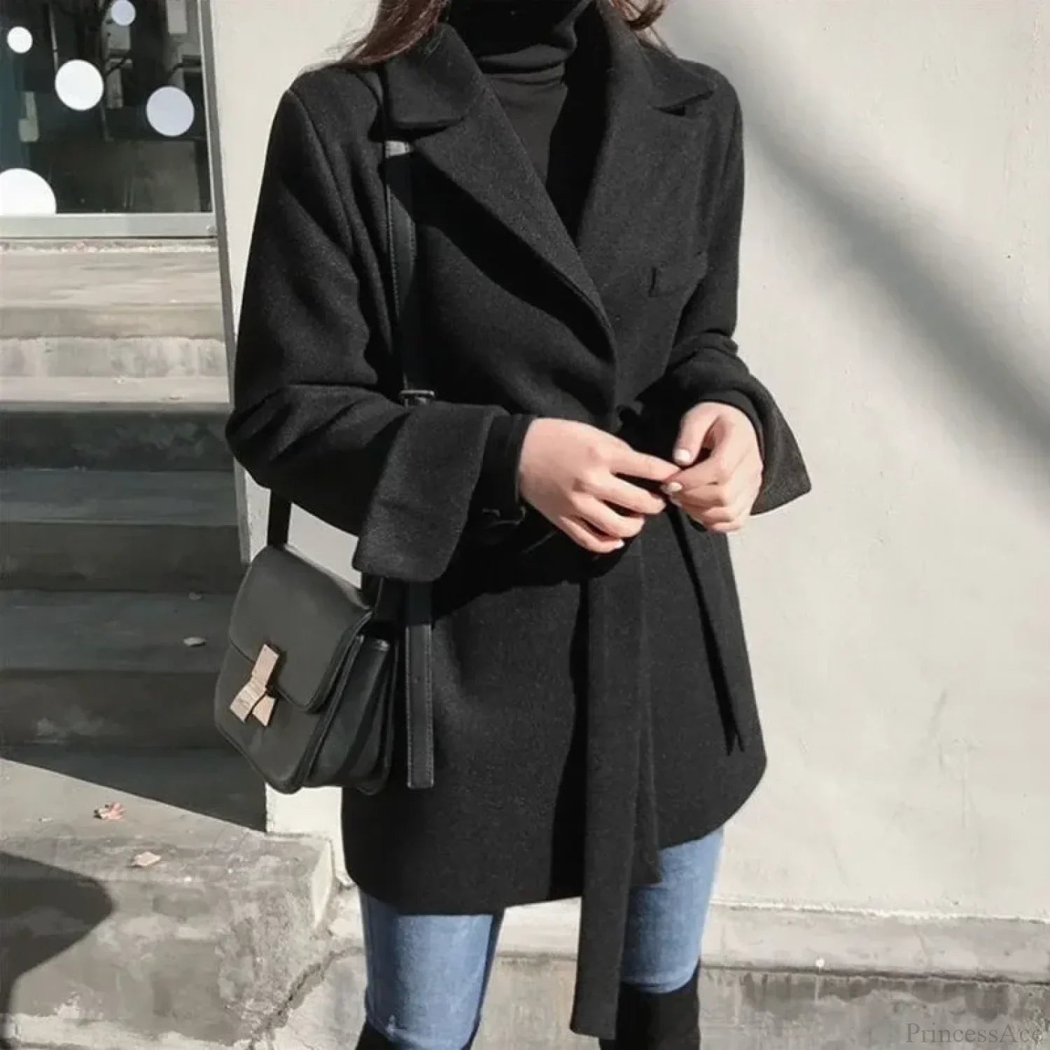 Manteau long noir en laine mélangée à lacets