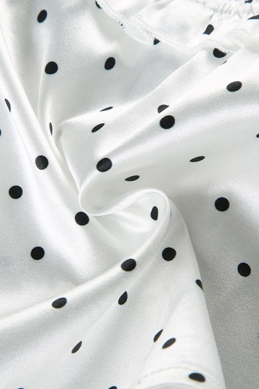 Haut court à bretelles fines avec nœud et décolleté plongeant à pois