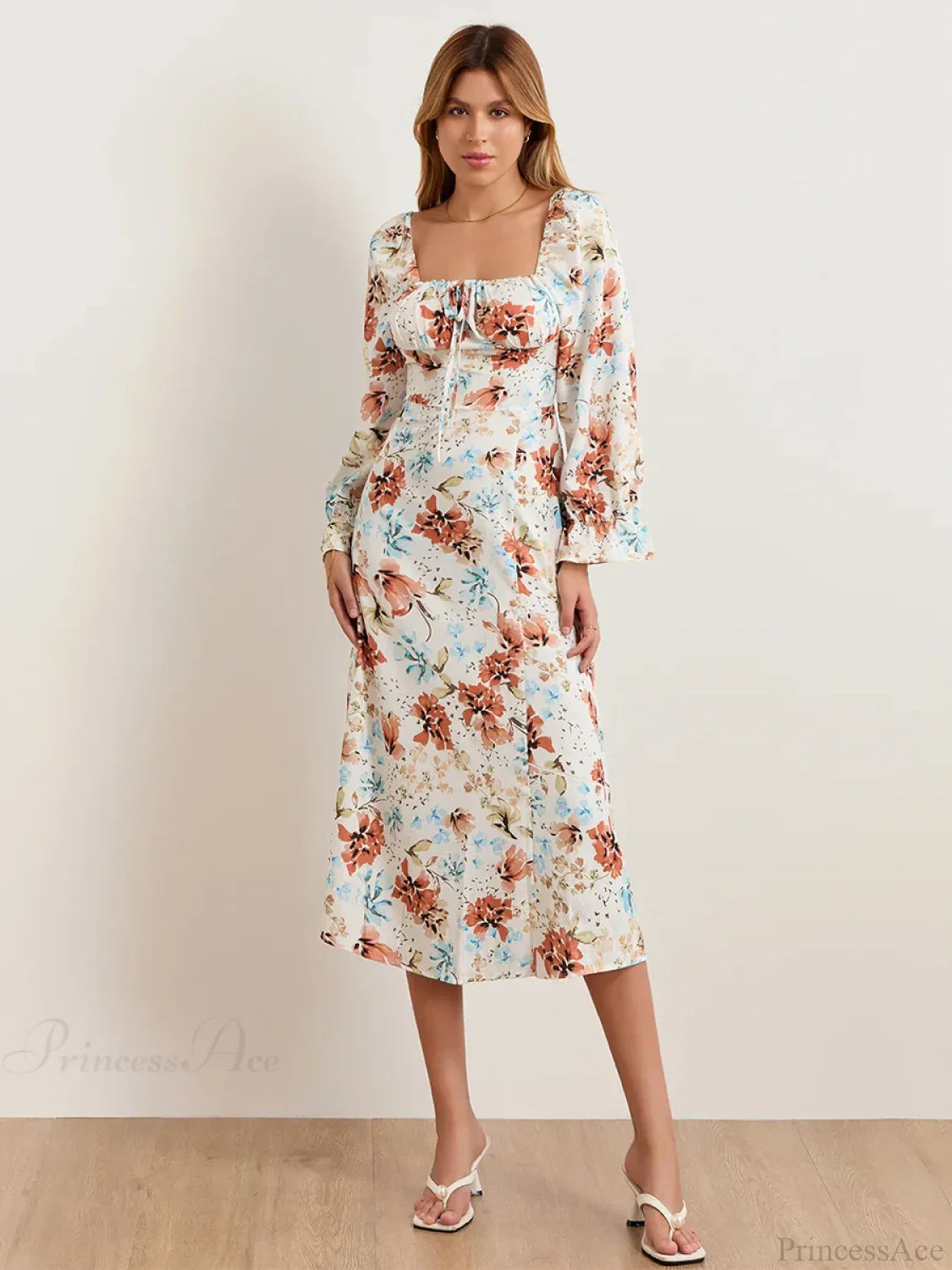 Vestido floral elegante midi con mangas abullonadas y escote cuadrado