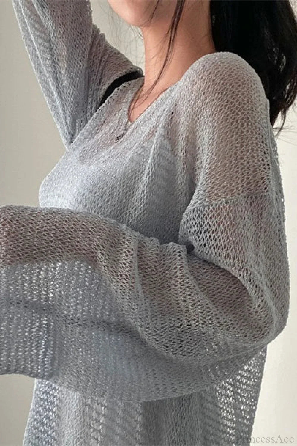 Blusa Chique de Malha com Manga Longa Solta e Trabalhada em Ponto Ajour