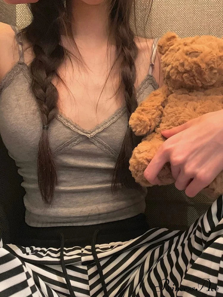 Maglia a maniche lunghe alla moda con pannelli in pizzo e bottoni