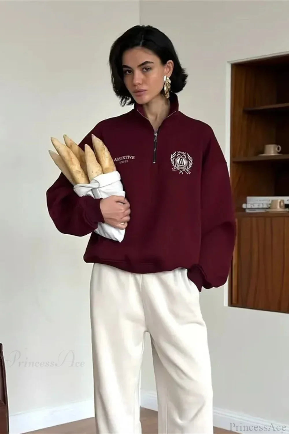 Felpa con collo alto a mezza cerniera, foderata in pile, dal taglio comodo e trasformabile