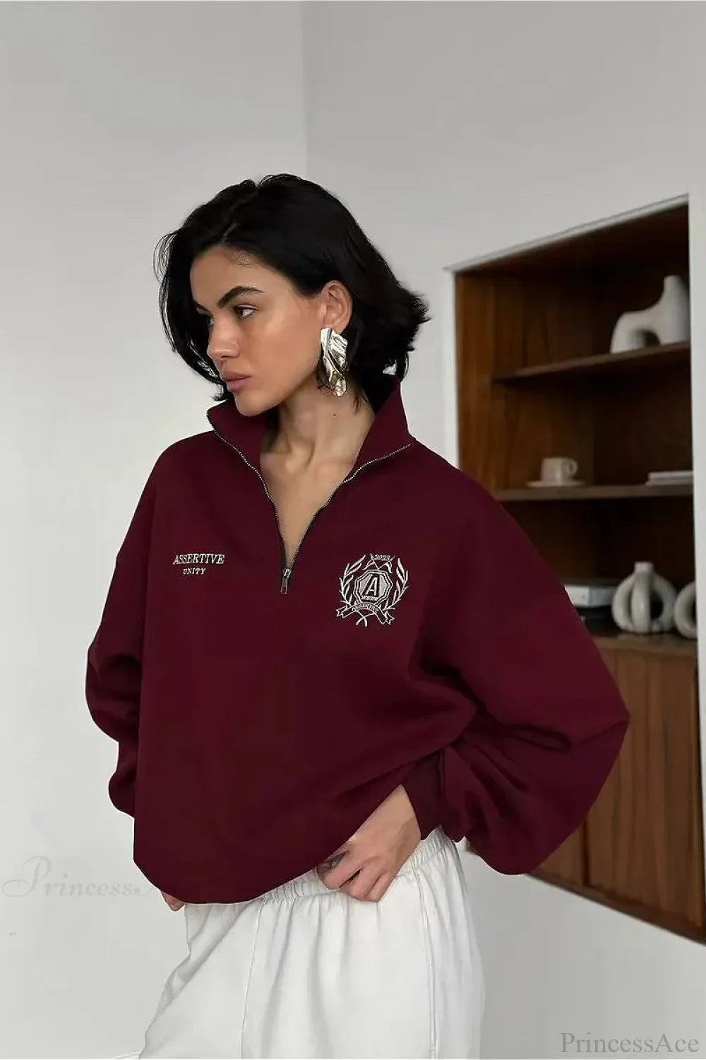 Felpa con collo alto a mezza cerniera, foderata in pile, dal taglio comodo e trasformabile