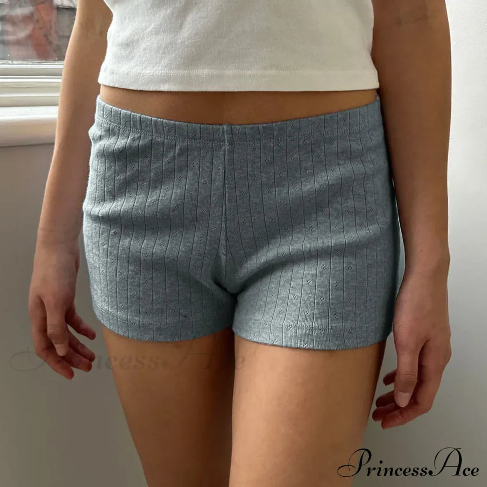 Pigiama corto aderente stile retrò carino con bottoni sul davanti e vita elastica tinta unita