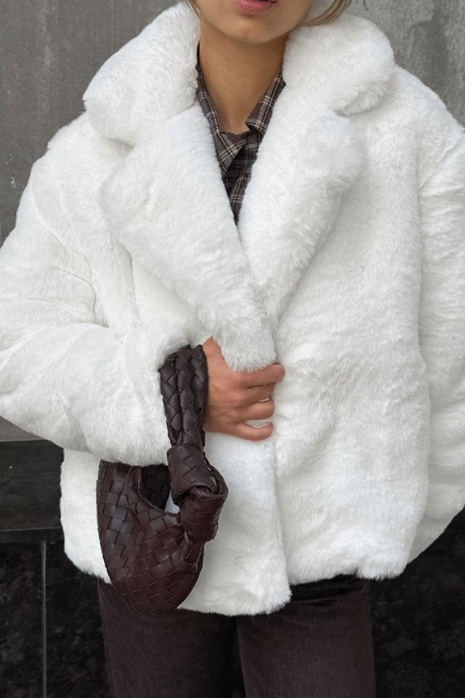 Abrigo suelto minimalista de forro polar de color sólido