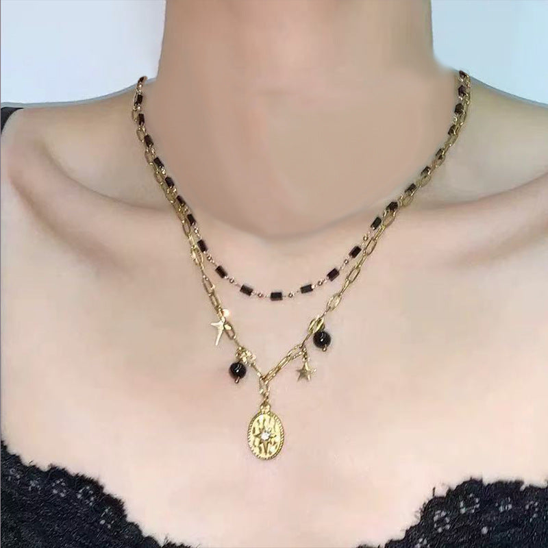 Collana a doppio strato con girasole, croce e serpente