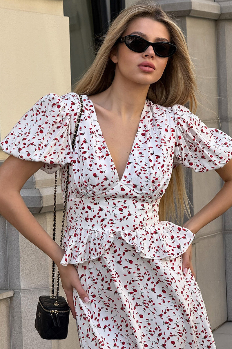 Kleid mit Puffärmeln, tailliertem Schnitt und Blumenmuster