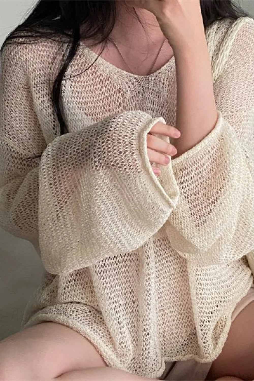 Blusa holgada de manga larga con tejido calado y estilo elegante