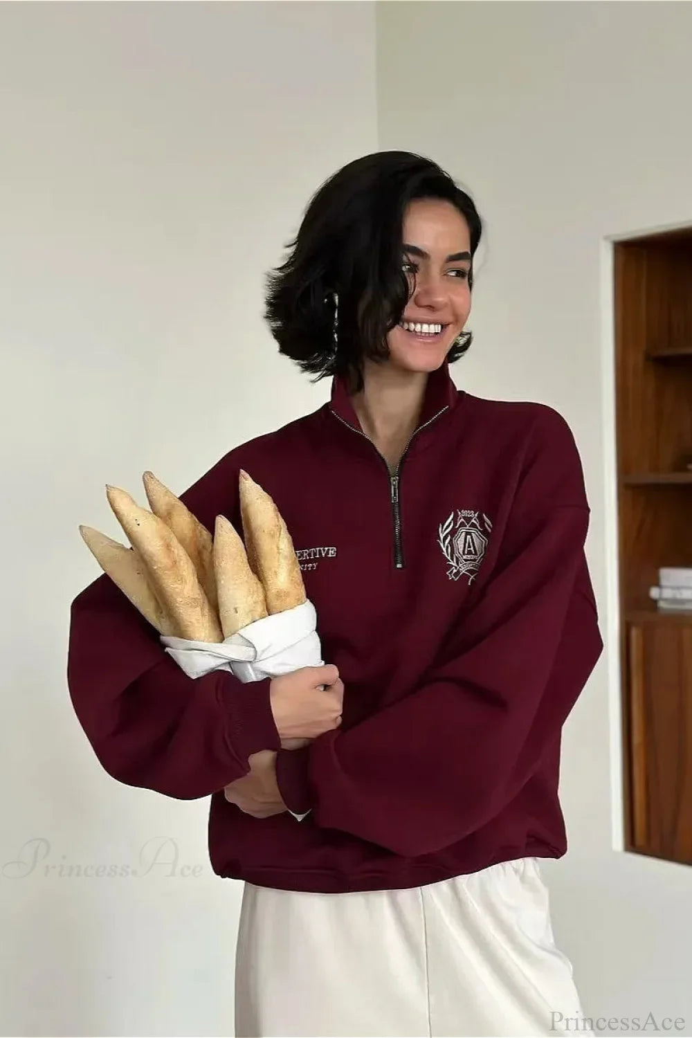 Felpa con collo alto a mezza cerniera, foderata in pile, dal taglio comodo e trasformabile